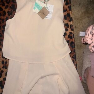 Umgee New with tags shorts jumpsuit. Never worn. So cute on!